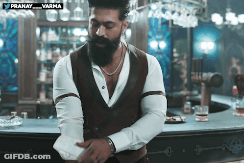 Man With Beard Standing In Front Of Bar Pranay Varma GIF