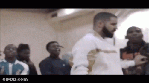 Man With Beard Standing In Front Of Crowd GIF