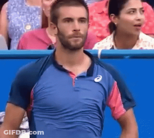 Man With Beard Standing In Front Of Crowd GIF