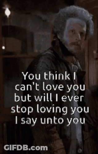Man With Beard Standing In Front Of Neva Sign GIF
