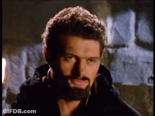 Man With Beard Standing In Front Of Stone Wall GIF