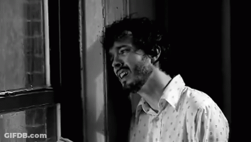 Man With Beard Standing In Front Of Window GIF