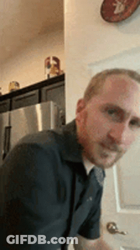 Man With Beard Standing In Kitchen GIF