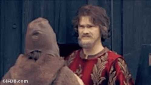 Man With Beard Standing Next To Stuffed Animal GIF