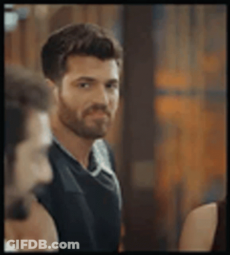 Man With Beard Standing Next To Woman GIF