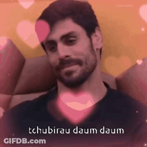 Man With Beard Surrounded By Pink Hearts Tchubirau Daum Daum GIF