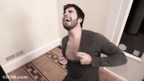 Man With Beard Taking Off Shirt GIF