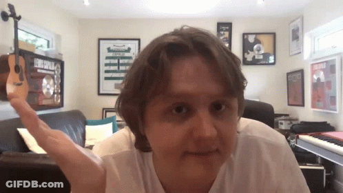 Man With Beard Talking Into Microphone With MetLife Sign GIF