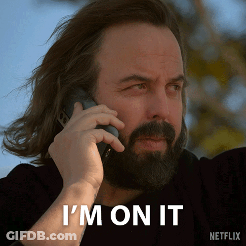 Man With Beard Talking On Phone GIF
