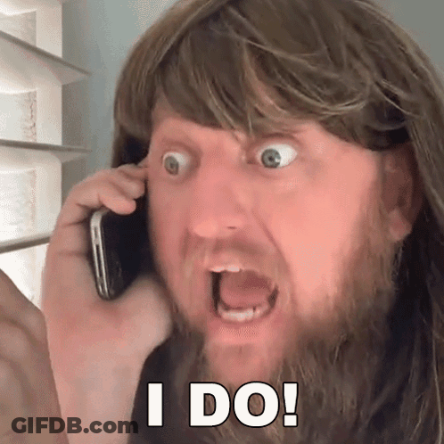Man With Beard Talking On Phone GIF