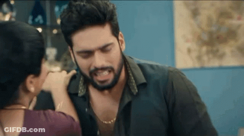 Man With Beard Touched By Woman In Room GIF