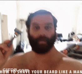 Man With Beard Touching Face GIF