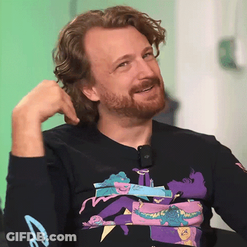Man With Beard Wearing Black Shirt With Woman Laying On Man's Chest GIF