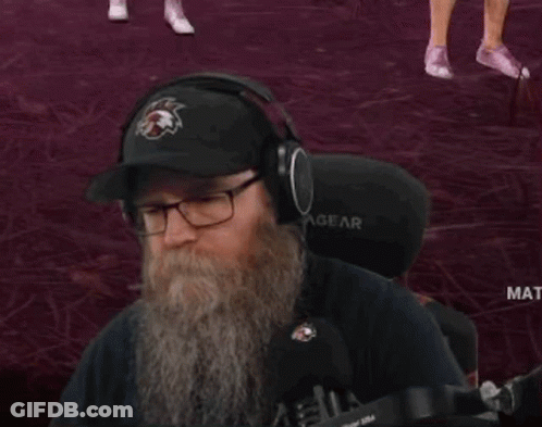 Man With Beard Wearing Eagles Hat And Headphones GIF