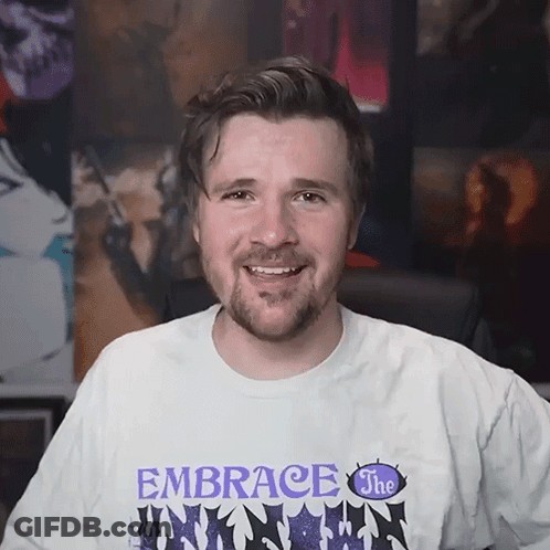 Man With Beard Wearing Embrace The Unknown Shirt GIF