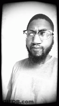 Man With Beard Wearing Glasses And Grey Shirt GIF