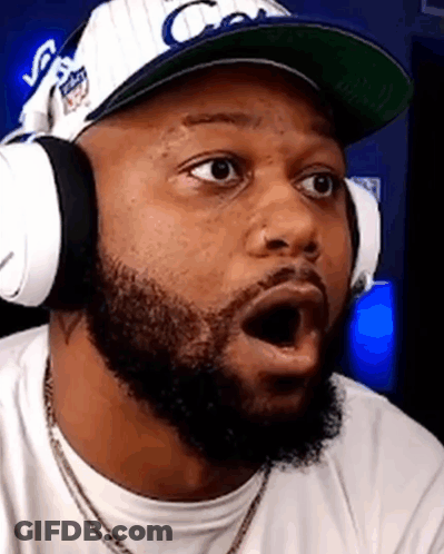 Man With Beard Wearing Headphones And Hat Making Funny Face GIF