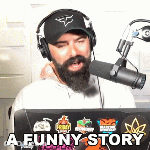 Man With Beard Wearing Headphones And Hat Says Funny Story GIF