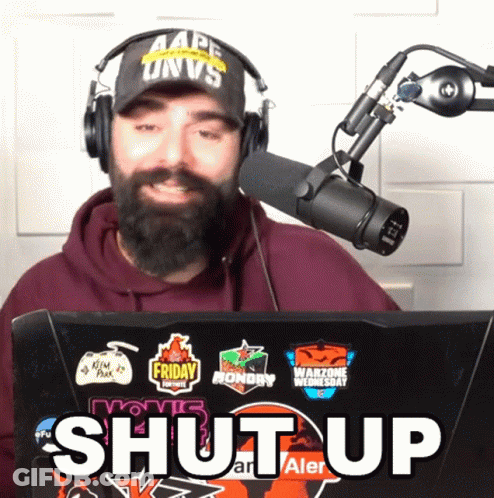 Man With Beard Wearing Headphones And Hat That Says Ape Univs GIF