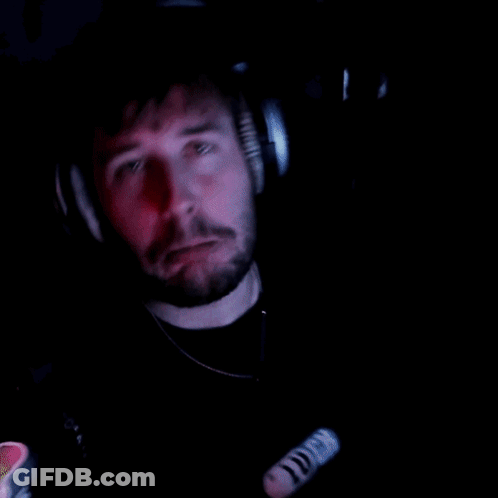 Man With Beard Wearing Headphones And Necklace With Letter O GIF