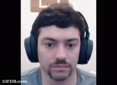 Man With Beard Wearing Headphones Looking At Camera GIF
