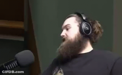 Man With Beard Wearing Headphones Talking Into Microphone GIF