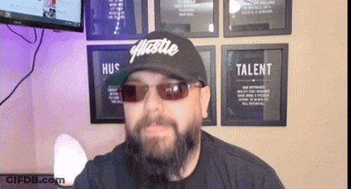 Man With Beard Wearing Hustle Hat GIF