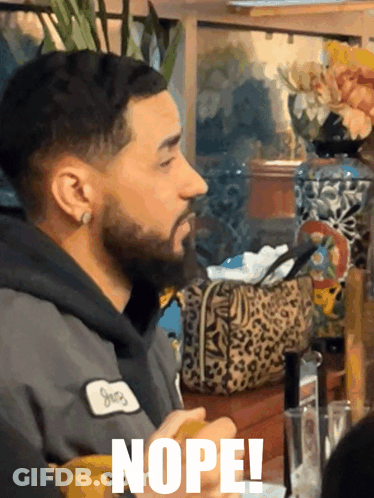 Man With Beard Wearing Nope Patch GIF