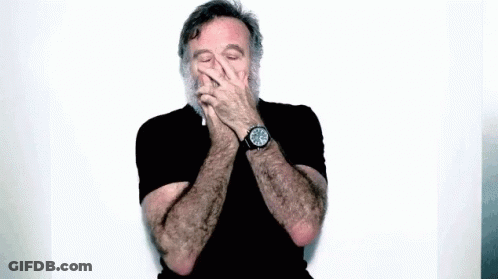 Man With Beard Wearing Watch And Black Shirt GIF