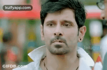 Man With Beard Wearing White Shirt And Earrings GIF