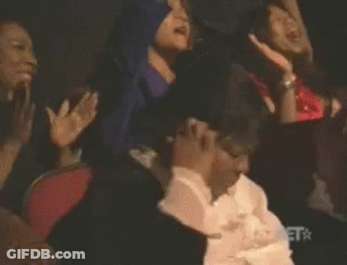 Man With Big Afro Holding Palette GIF