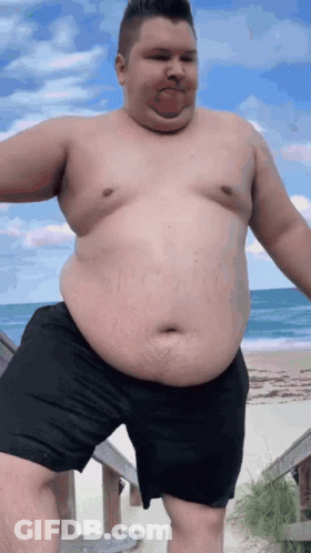 Man With Big Belly Standing On Beach GIF