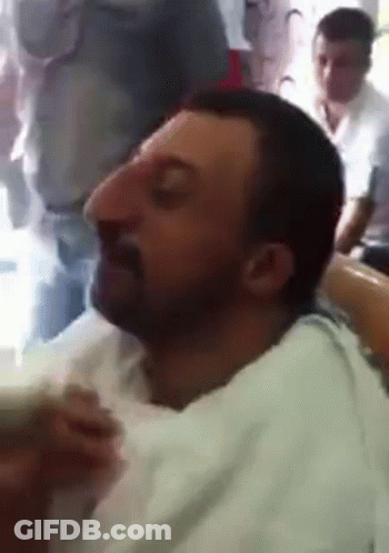 Man With Big Nose Sitting Eyes Closed GIF
