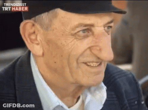 Man With Big Nose Smiling Wearing Trendizisst Hat GIF