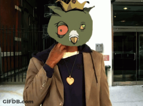 Man With Bird Mask In Front Of Building GIF