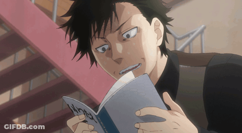 Man With Black Hair Reading Chinese Book GIF