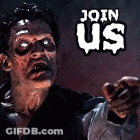 Man With Black Paint On Face In Front Of Crowd GIF