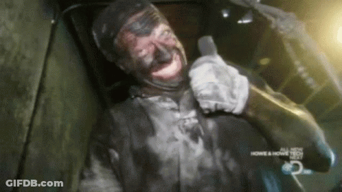 Man With Black Paint Smiling At Home & Home Tech Sign GIF