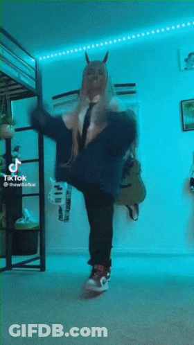 Man With Black Wings Looking At Camera GIF