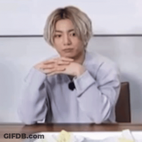 Man With Blonde Hair And Folded Hands GIF