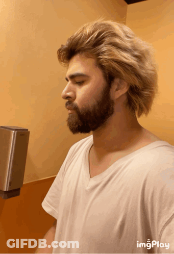 Man With Blonde Hair Taking Bathroom Selfie GIF
