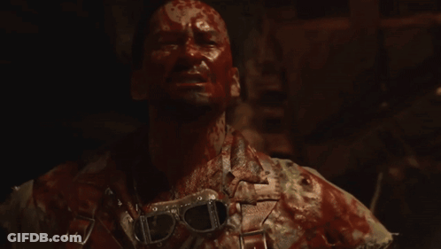 Man With Blood On Face Holding Hammer GIF