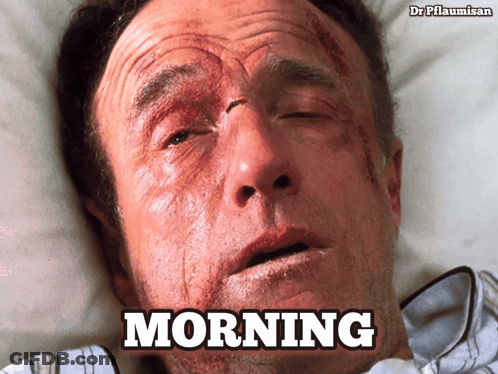 Man With Blood On Face In Bed Saying Morning GIF