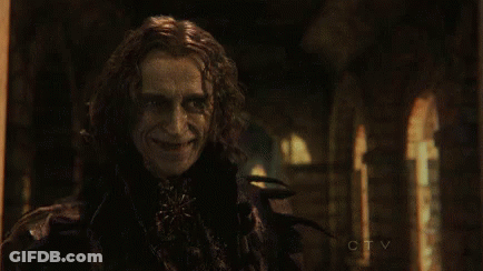 Man With Blood On Face In Dark Room GIF