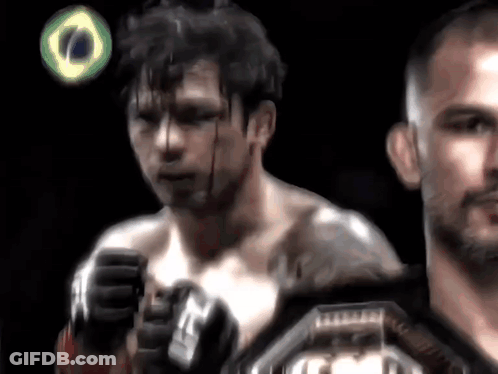 Man With Blood On Face Next To Another Man GIF
