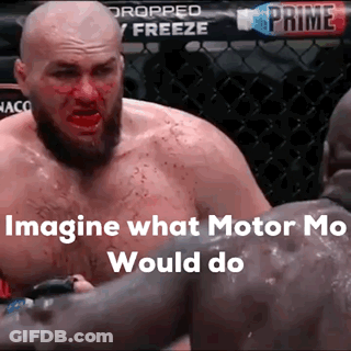Man With Blood On Face Next To Man In Cage GIF