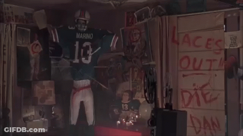 Man With Blood On Face Standing In Front Of Wall Saying Laces Out Die Dan GIF