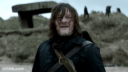 Man With Blood On Face Standing On Grassy Hill GIF