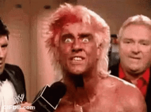 Man With Blood On Face Talking Into Microphone GIF