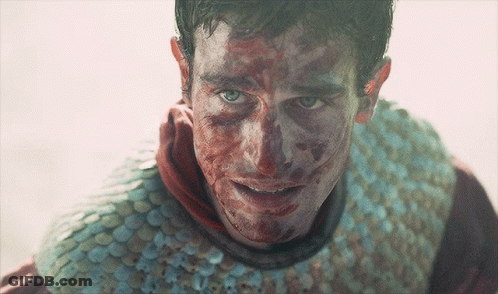 Man With Blood On Face Wearing Armor GIF